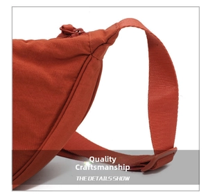 Detail view of durable orange nylon bag showing reinforced seams and premium stitching quality
