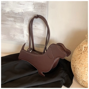 Detailed view of creative dachshund shaped dark brown tote bag with premium leather texture