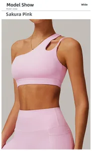 Detail of sakura pink one-shoulder yoga bra with asymmetric strap and hollow cut-out design