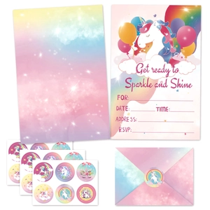 Close-up of unicorn party invitation set with envelopes and sparkle stickers