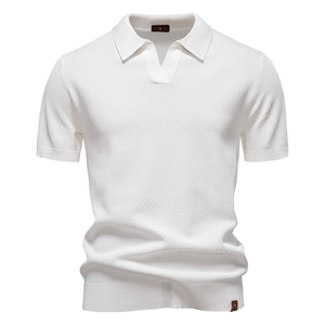Close-up of white waffle knit polo shirt showing textured fabric and V-neck detail