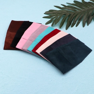 Microfiber velvet envelope jewelry pouches in various colors arranged in a fan-like layout