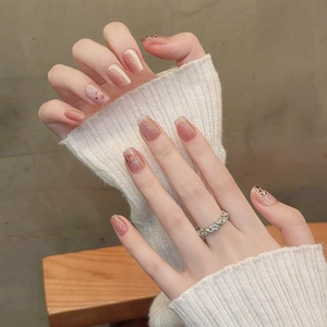 Cat paw press-on nails in pink brown gradient with glitter and 3D details for women