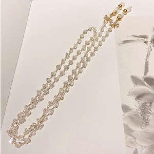Detail of beaded crystal glasses chain with gold clasps and non-slip rubber loops