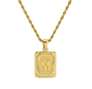 Detailed view of an 18K gold plated square pendant featuring a sunburst letter M design