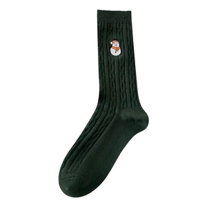 Dark green knitted crew socks featuring snowman embroidery and classic cable knit texture