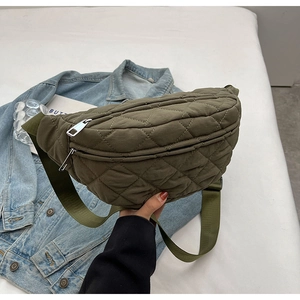 Olive green quilted nylon crossbody bag with adjustable strap and zipper closure