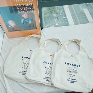Trois sacs cabas en toile minimalistes avec imprimés dessins animés et fermoirs aimantés