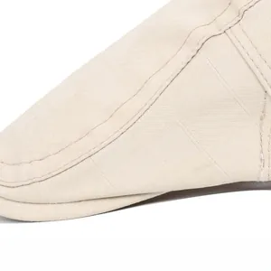 Detailed macro view showing the precise double-stitching and fabric texture of the flat cap
