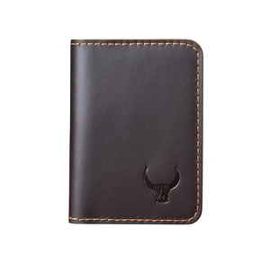 Detail of crazy horse leather wallet with embossed bull head logo and hand-stitched seams