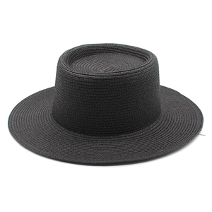 Elegant black wide brim straw sun hat with flat top for summer beach protection