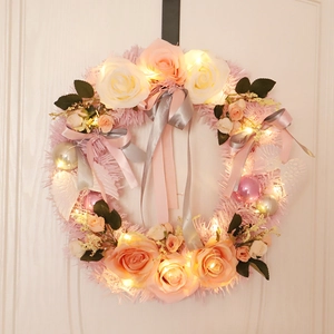 Pink artificial rose wreath with warm LED lights and plush base for home front door decoration