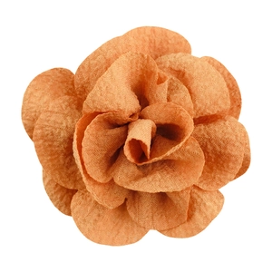 Detailed top view of a 7cm orange handmade bubble crepe fabric flower accessory