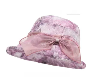 Detail of light purple organza sun hat with elegant floral embroidery and large bow