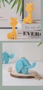 Detailed view of yellow giraffe and blue elephant cartoon animal scented candles