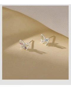 Detailed view of S999 silver butterfly earrings with colorful inlaid gemstone wings