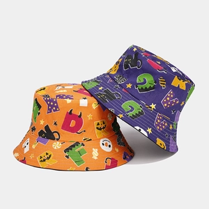 Detail of Halloween bucket hats in orange and purple with festive monster prints