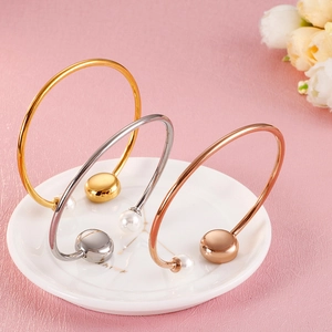 Three-color pearl and evil eye open cuff bracelets in gold, silver, and rose gold finish