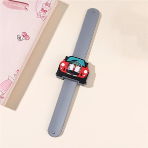 Detail of red cartoon race car dial on a soft grey silicone slap watch for kids