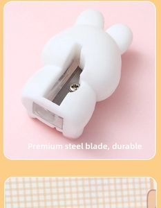 Detail view of the high-quality steel blade inside a cute white rabbit pencil sharpener