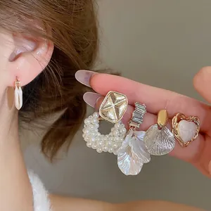 Elegant set of Korean style pearl and rhinestone heart earrings in gold finish