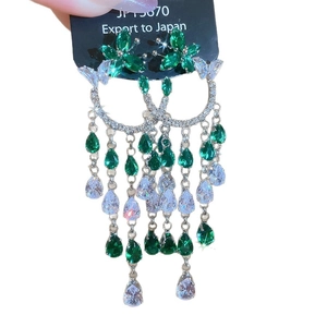 Silver needle bow tassel earrings with green crystals and water drop zirconia pendants