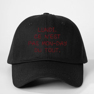Adjustable black cotton baseball cap with red LUNDI CE N'EST PAS MON-DAY slogan print
