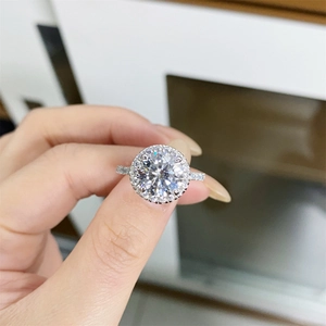 Macro shot of a 925 silver ring featuring a round moissanite center with halo setting