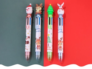 Detail of Christmas multi-color ballpoint pens with Santa and reindeer cartoon toppers
