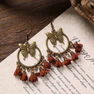 Bohemian bronze butterfly earrings with red fabric flower tassels and wooden beads decor