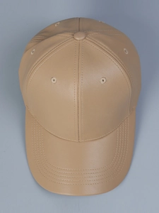Top view of premium PU leather baseball cap with reinforced stitching on curved brim