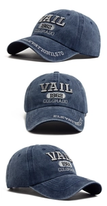 Detailed 3D embroidery of VAIL Colorado on washed blue cotton vintage baseball cap