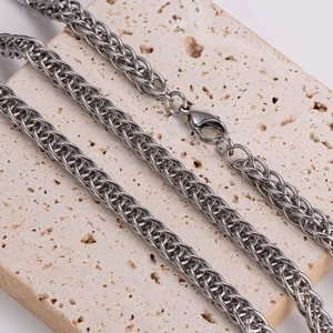 Sleek 7mm silver foxtail chain necklace with lobster clasp on stone display
