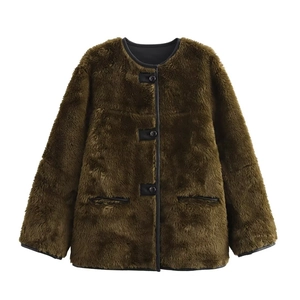 Close-up of olive faux fur coat showing plush texture, black trim and round buttons