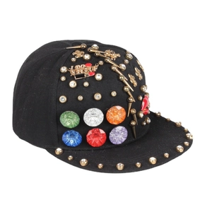 Hip hop snapback hat featuring gold studs, metal spikes, and colorful gemstones