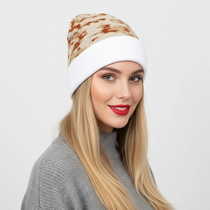 Close-up of camouflage knitted beanie with white fold-over cuff and thick texture
