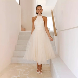 Elegant white mesh halter neck dress for women with high waist and midi-length skirt