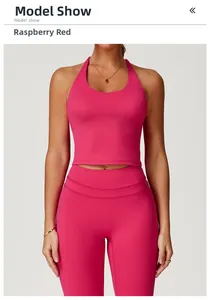 Detail of raspberry red criss-cross back yoga vest with high-waist sports leggings