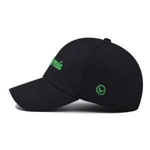 Close-up of green California embroidery and circular logo on black cotton baseball cap