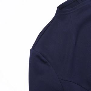 Close-up of the high-density navy blue fabric and premium stitching on the dress