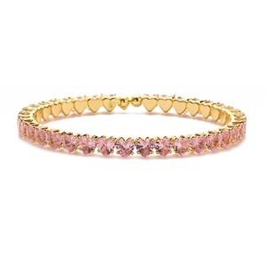 Luxurious gold-plated tennis bracelet with pink heart-shaped crystals in a row