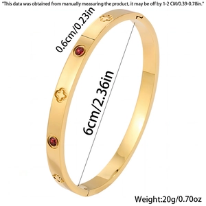 Detail view of gold clover bangle with red zircon showing 6cm diameter and 0.6cm width