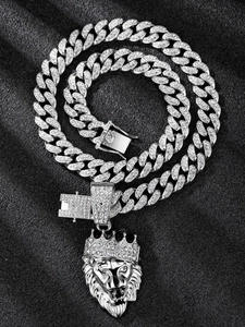 Close-up of hip hop silver Cuban link necklace with iced out crown lion head pendant
