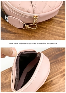 Detail of pink quilted bag showing the detachable strap hook and interior storage space