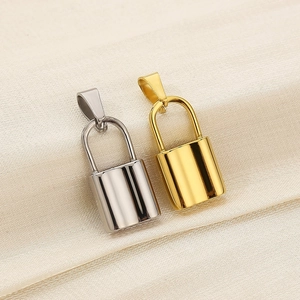 Macro shot of polished gold and silver lock pendants for DIY jewelry making