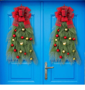 Red and green Christmas door swags with mesh and baubles on blue double doors