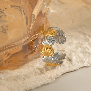 Two-tone gold and silver scallop shell open cuff bracelet with minimalist ocean design