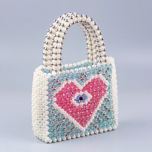Handmade woven pearl beaded handbag with pink heart pattern and blue evil eye detail
