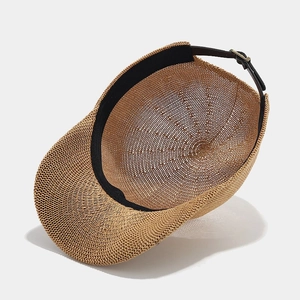 Straw weave baseball cap with adjustable leather strap and breathable texture in khaki