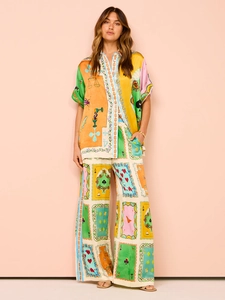 Detail of silk-like vibrant tarot print set with short-sleeve shirt and wide-leg pants